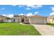 Charming single-Gathering home featuring a well-maintained lawn and two car garage at 3787 Sandhill Crane Dr, Lakeland, FL 33811