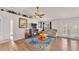 Bright living room showcasing hardwood floors, a fireplace, and a comfortable couch at 3787 Sandhill Crane Dr, Lakeland, FL 33811