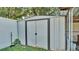 Metal storage shed in backyard surrounded by grass and fence at 3787 Sandhill Crane Dr, Lakeland, FL 33811