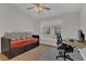 Bedroom featuring hardwood floors, a ceiling fan, and a comfortable daybed at 4309 Shipp Ct, Lakeland, FL 33813
