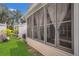 Spacious screened-in porch with a view of the landscaped backyard, creating a comfortable outdoor living area at 4309 Shipp Ct, Lakeland, FL 33813