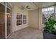 Enclosed sunroom with tile flooring and bright natural light at 4309 Shipp Ct, Lakeland, FL 33813