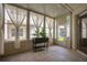 Enclosed sunroom with tile flooring and bright natural light at 4309 Shipp Ct, Lakeland, FL 33813