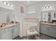 Spa-like bathroom with dual vanities, a soaking tub, and elegant finishes at 4340 Reding Way, Lakeland, FL 33813