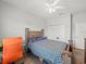 Bright bedroom featuring a ceiling fan, closet, and a comfortable bed with unique bedding at 4340 Reding Way, Lakeland, FL 33813