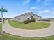 Charming house on a corner lot featuring a two-car garage and landscaped front yard at 4340 Reding Way, Lakeland, FL 33813