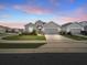 Charming single-story home featuring a well-manicured lawn and inviting curb appeal at 4340 Reding Way, Lakeland, FL 33813