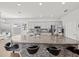 Modern kitchen boasts an island with bar seating, gray cabinets, and stainless steel appliances at 4340 Reding Way, Lakeland, FL 33813