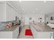Spacious kitchen featuring a large island, granite countertops, and modern appliances at 4340 Reding Way, Lakeland, FL 33813