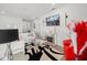 Comfortable living space featuring modern decor, a sleek television, and plush seating at 4340 Reding Way, Lakeland, FL 33813