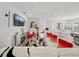 Bright living room with modern decor, stylish furnishings, and a large television at 4340 Reding Way, Lakeland, FL 33813