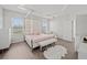 Bright and airy main bedroom with a bed and an ensuite bath at 4340 Reding Way, Lakeland, FL 33813