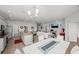 Open-concept living space seamlessly connecting the kitchen, dining, and living areas at 4340 Reding Way, Lakeland, FL 33813