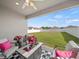 Covered patio with stylish furniture overlooking a spacious, fenced backyard at 4340 Reding Way, Lakeland, FL 33813
