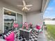 Outdoor patio offers comfortable seating, decor, ceiling fan, and space for relaxing at 4340 Reding Way, Lakeland, FL 33813