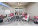 Covered patio with a cozy seating area, ideal for outdoor relaxation and entertaining at 4340 Reding Way, Lakeland, FL 33813