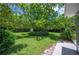 Large, well maintained backyard featuring a mature tree providing plenty of shade and green space at 4908 S Bedford Ln, Lakeland, FL 33813