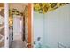 Bathroom with retro wallpaper, and a tiled shower/tub at 4908 S Bedford Ln, Lakeland, FL 33813