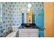 Bathroom with floral wallpaper, tile, and a vanity at 4908 S Bedford Ln, Lakeland, FL 33813