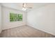 Bright bedroom featuring plush carpeting and a large window for lots of natural light at 4908 S Bedford Ln, Lakeland, FL 33813