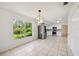 Charming dining area with modern lighting and views of the backyard at 4908 S Bedford Ln, Lakeland, FL 33813