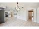 Bright, open dining area with pendant lighting and adjacent kitchen at 4908 S Bedford Ln, Lakeland, FL 33813