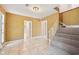 The Foyer features tile flooring, staircase with carpet, and light fixture at 4908 S Bedford Ln, Lakeland, FL 33813