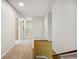 Bright hallway with carpet and a staircase featuring a decorative railing and wallpaper at 4908 S Bedford Ln, Lakeland, FL 33813