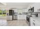 Modern kitchen featuring stainless steel appliances and bright white cabinetry at 4908 S Bedford Ln, Lakeland, FL 33813