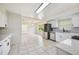 Updated kitchen with stainless steel appliances, white cabinets, and modern fixtures at 4908 S Bedford Ln, Lakeland, FL 33813