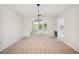Open living area with modern lighting and access to kitchen and dining spaces at 4908 S Bedford Ln, Lakeland, FL 33813