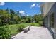 Enjoy the outdoors on this concrete patio and spacious backyard with lush greenery and ample room at 4908 S Bedford Ln, Lakeland, FL 33813