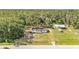 Ariel view of property surrounded by mature trees and an additional building on the lot at 4931 Dove Cross Dr, Lakeland, FL 33810
