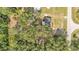 Aerial view of a lot surrounded by mature trees, with a home at 4931 Dove Cross Dr, Lakeland, FL 33810