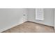 The bedroom features laminate flooring, a window with blinds, and white baseboards at 4931 Dove Cross Dr, Lakeland, FL 33810