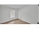 This bedroom features modern laminate flooring, a window, and neutral walls at 4931 Dove Cross Dr, Lakeland, FL 33810