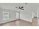 Bright bedroom with light wood flooring, white walls, and multiple windows at 4931 Dove Cross Dr, Lakeland, FL 33810