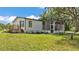 Cozy home with a screened-in porch perfect for enjoying the outdoors at 4931 Dove Cross Dr, Lakeland, FL 33810