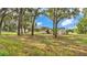 Charming single-story home with a spacious yard and mature trees creating a serene and private setting at 4931 Dove Cross Dr, Lakeland, FL 33810