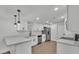 Bright kitchen featuring stainless steel appliances, quartz countertops and white cabinetry at 4931 Dove Cross Dr, Lakeland, FL 33810