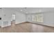 Spacious living room with light wood flooring, and bright white walls at 4931 Dove Cross Dr, Lakeland, FL 33810