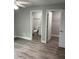 Neutral bedroom showcasing access to the en-suite bathroom and walk-in closet at 502 & 504 2Nd Sw St, Fort Meade, FL 33841