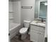 Bathroom featuring a shower-tub, granite countertop vanity, and a ceiling fan at 526 & 528 2Nd Sw St, Fort Meade, FL 33841