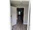 Bright kitchen features stainless steel appliances, grey vinyl flooring, and modern finishes at 526 & 528 2Nd Sw St, Fort Meade, FL 33841