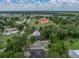Aerial shot of a home in an expansive community with a church nearby at 5522 1St Se St, Lakeland, FL 33812