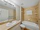 Bathroom with a tub, shower, and a modern vanity offering comfort and functionality at 5522 1St Se St, Lakeland, FL 33812