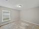 Cozy bedroom with a large window, providing natural light and a comfortable atmosphere at 5522 1St Se St, Lakeland, FL 33812