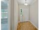Well-lit foyer with tile flooring leading to other rooms in the home at 5522 1St Se St, Lakeland, FL 33812