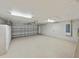 Spacious two car garage featuring ample storage cabinets and lighting at 5522 1St Se St, Lakeland, FL 33812