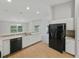 Bright kitchen featuring white cabinets, stainless sink and appliances and ample counter space at 5522 1St Se St, Lakeland, FL 33812